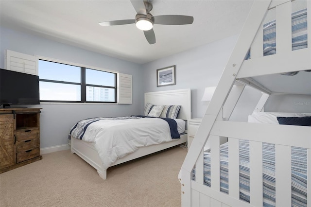 bedroom featuring ceiling fan and light carpet