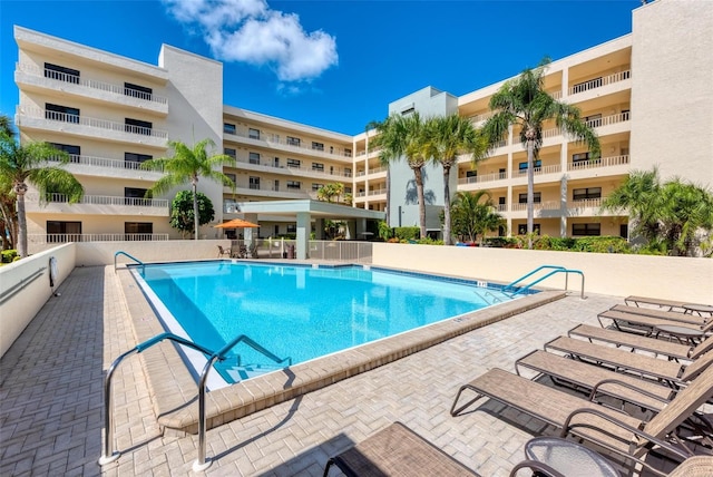 view of pool featuring a patio