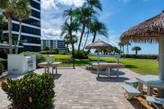 surrounding community featuring a gazebo, a patio area, and a yard