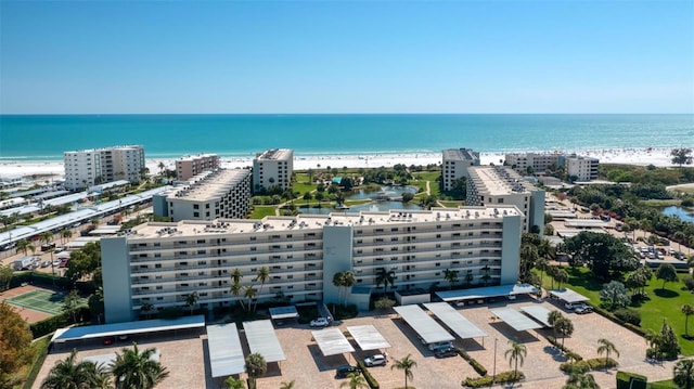 bird's eye view with a water view and a view of the beach