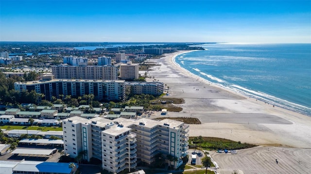 birds eye view of property with a view of the beach and a water view