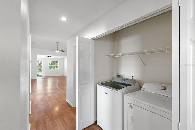 washroom with ceiling fan, hardwood / wood-style floors, and washer and dryer