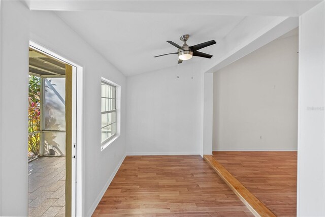 unfurnished room with light hardwood / wood-style floors, ceiling fan, and lofted ceiling