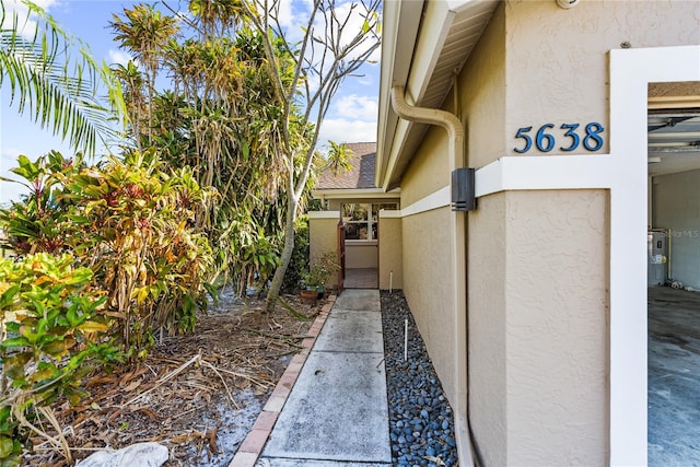 view of property exterior featuring electric water heater