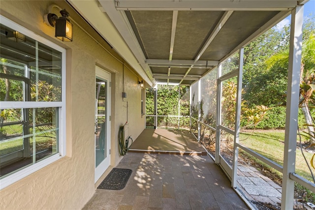 unfurnished sunroom with a wealth of natural light