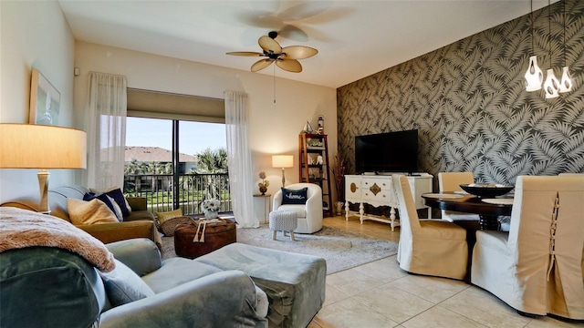 4046 Overture Cir Unit 4046, Bradenton, FL 34209 - living area with wallpapered walls, an accent wall, a ceiling fan, and tile patterned floors