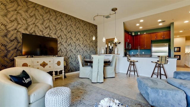 4046 Overture Cir Unit 4046, Bradenton, FL 34209 - living room with wallpapered walls, light tile patterned flooring, an accent wall, and recessed lighting