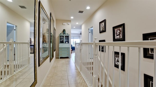 4046 Overture Cir Unit 4046, Bradenton, FL 34209 - hall with light tile patterned floors, recessed lighting, and an upstairs landing