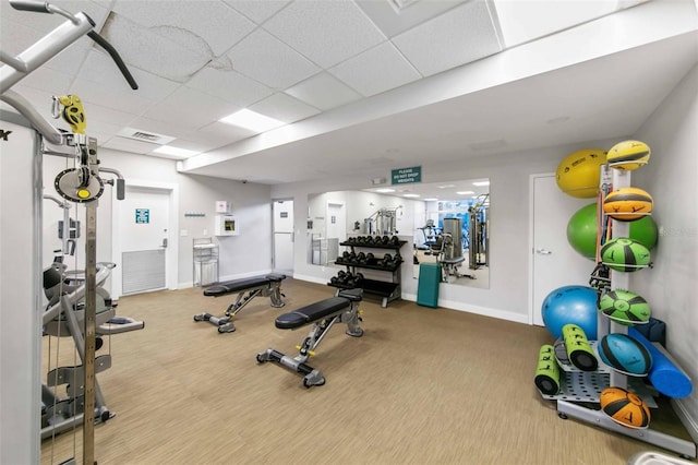 workout area with a drop ceiling