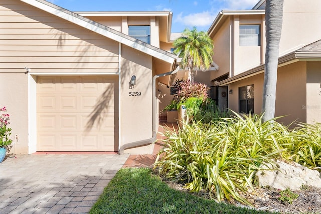 property entrance with a garage