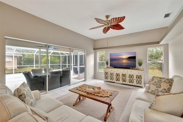 living room with light tile patterned floors and a healthy amount of sunlight