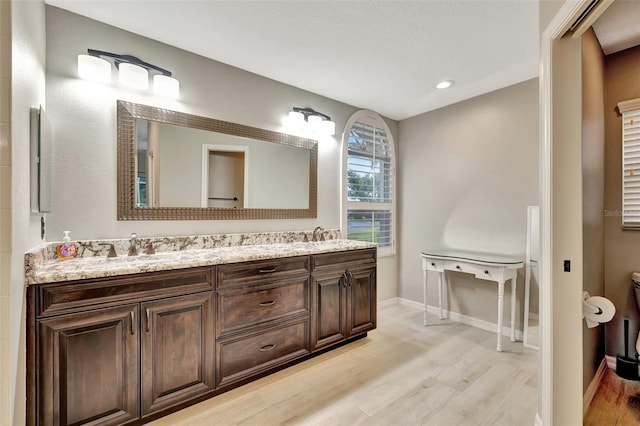 bathroom featuring vanity and hardwood / wood-style flooring