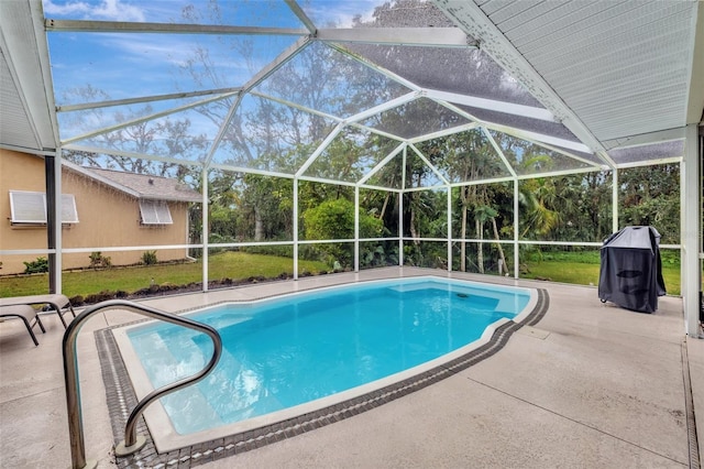 view of pool with a lanai and a patio area