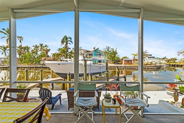 exterior space featuring a water view and lofted ceiling