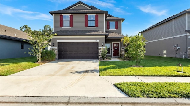 front facade with a front yard and a garage