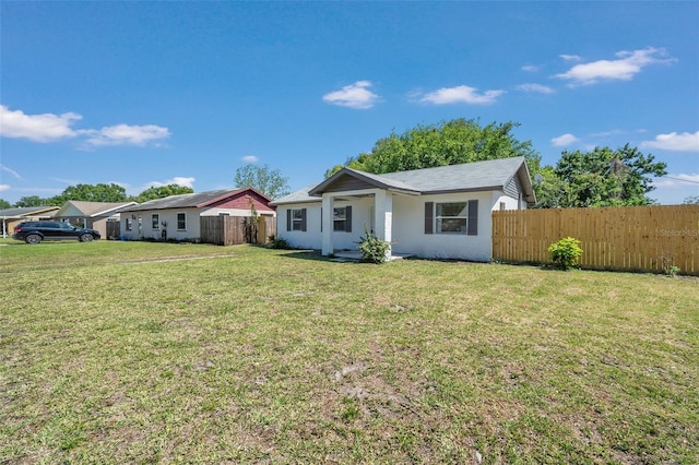 ranch-style house with a front yard