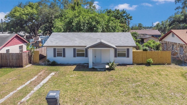 ranch-style house with a front lawn