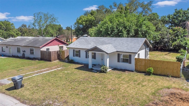 ranch-style home with a front lawn