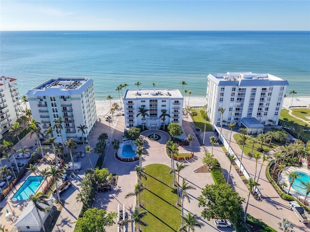 birds eye view of property with a view of the beach and a water view