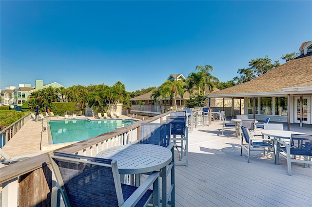 view of swimming pool featuring a wooden deck