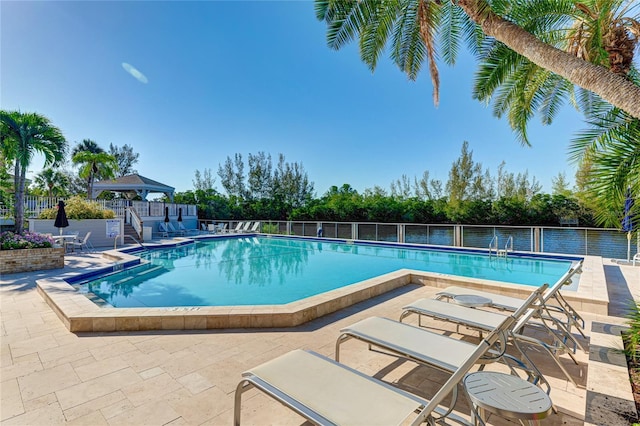 view of swimming pool featuring a gazebo and a patio