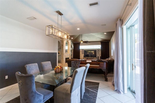 tiled dining area with ceiling fan