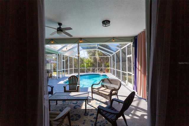 view of swimming pool with a lanai and a patio area