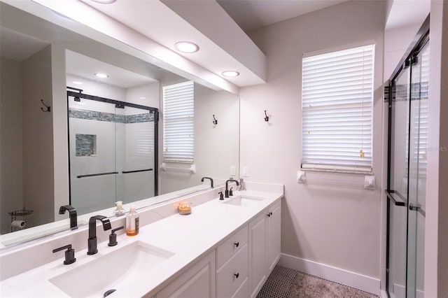 bathroom featuring an enclosed shower and vanity