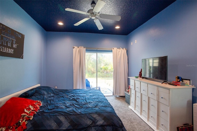 bedroom with a textured ceiling, access to exterior, light carpet, and ceiling fan