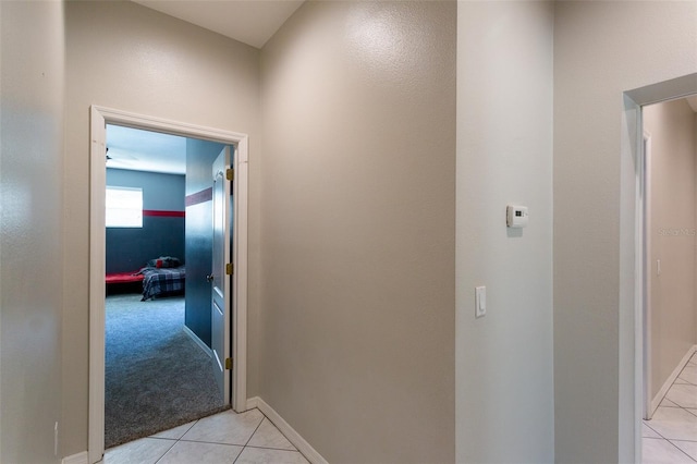 corridor with light tile patterned floors