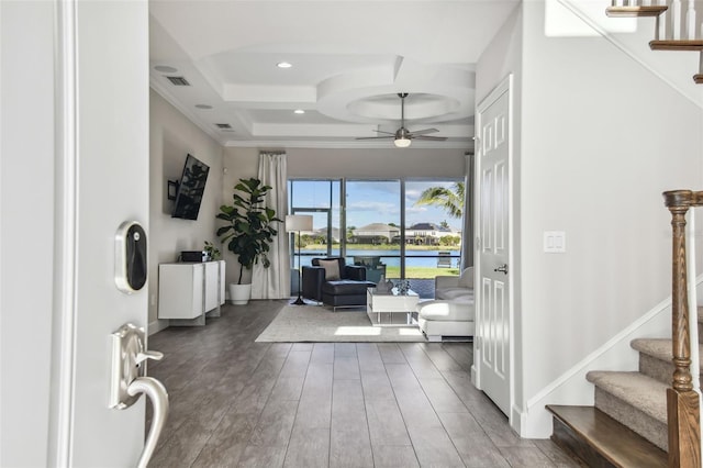 interior space with dark hardwood / wood-style flooring, crown molding, ceiling fan, and coffered ceiling