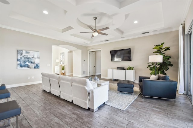 living room with hardwood / wood-style flooring, ceiling fan, ornamental molding, and coffered ceiling