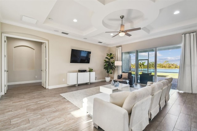 living room featuring ceiling fan, crown molding, light hardwood / wood-style flooring, and coffered ceiling