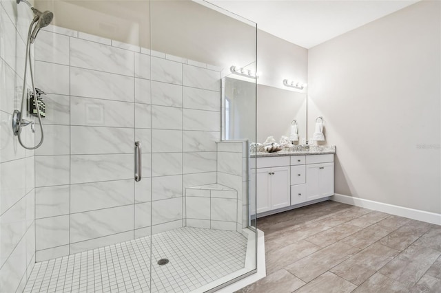 bathroom with vanity and walk in shower