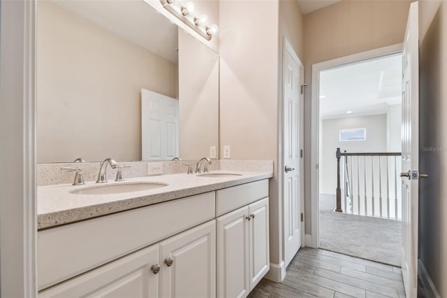 bathroom featuring hardwood / wood-style floors and vanity