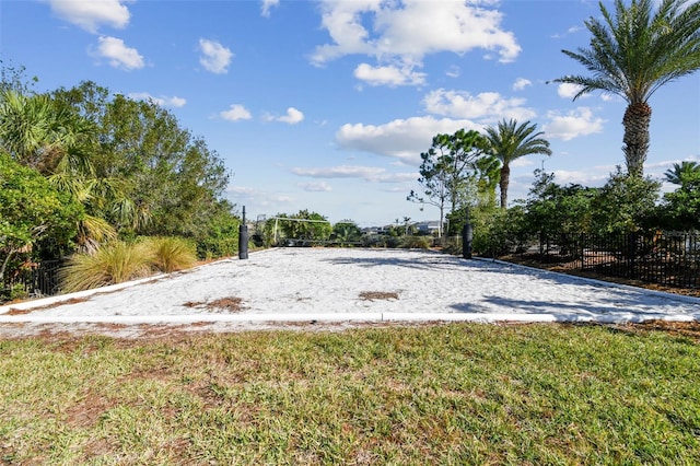 surrounding community featuring a lawn and volleyball court