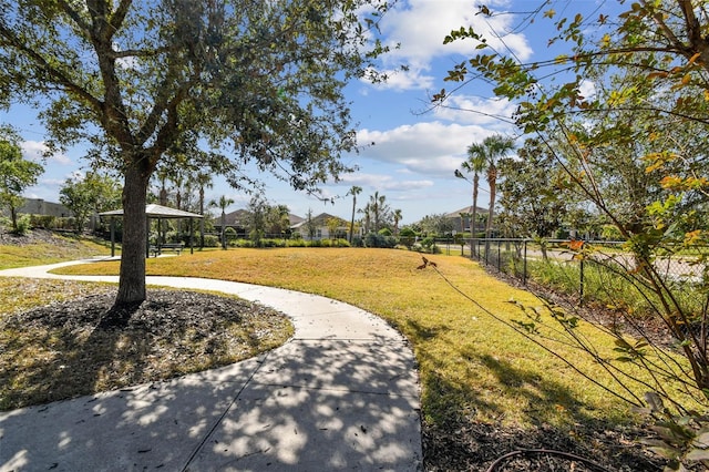 view of home's community with a lawn