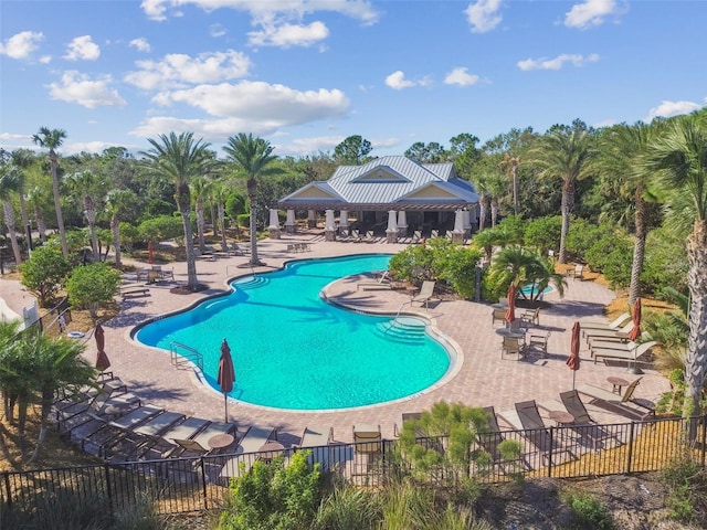 view of swimming pool featuring a patio area