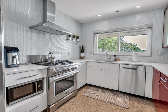 kitchen with white cabinetry, sink, wall chimney range hood, and appliances with stainless steel finishes