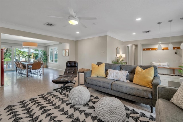 living room featuring ceiling fan and crown molding