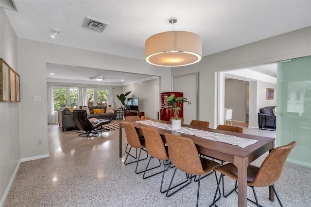 dining space with ceiling fan