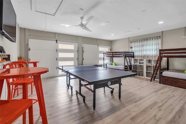 recreation room with wood-type flooring and ceiling fan