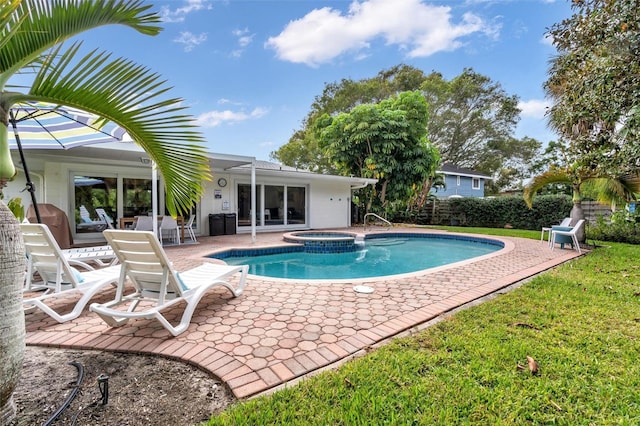 view of swimming pool with an in ground hot tub and a patio