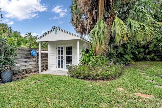 view of outbuilding with a yard