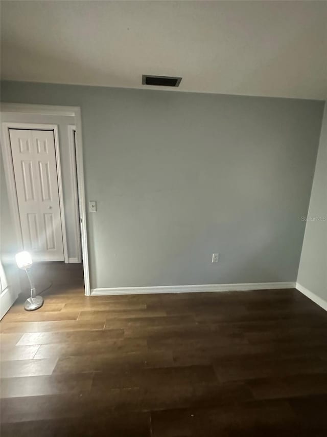 empty room featuring hardwood / wood-style flooring