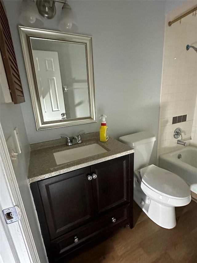 full bathroom featuring shower / bath combination, vanity, toilet, and wood-type flooring