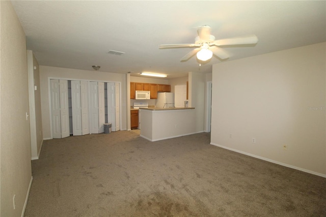 unfurnished living room featuring ceiling fan and light carpet