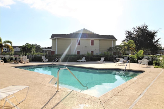 view of swimming pool featuring a patio