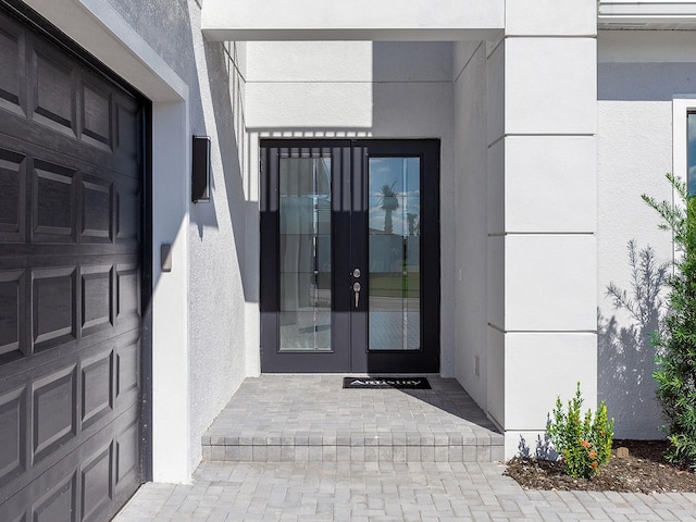 property entrance featuring french doors