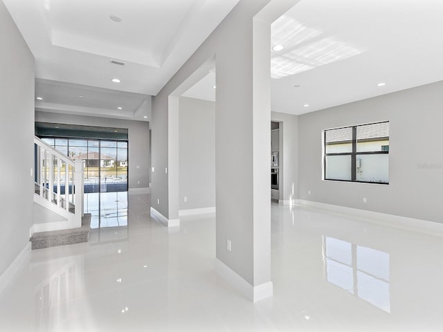 hall featuring light tile patterned flooring